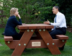 Obama and Hillary Clinton on a park bench